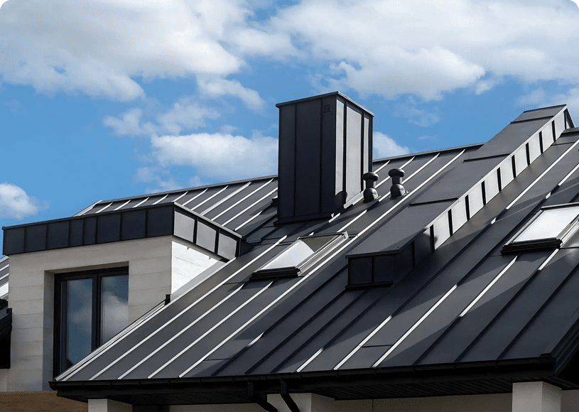 Black metal roofing under blue sky