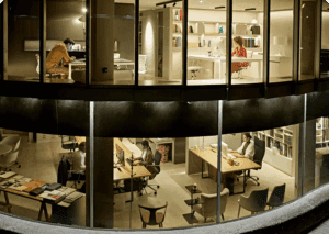 People working late in glass office