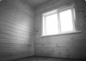 Empty wooden room with window